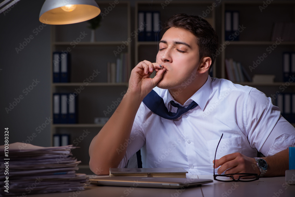 Man staying late at night and smoking marijuana Man staying late at night and smoking marijuana