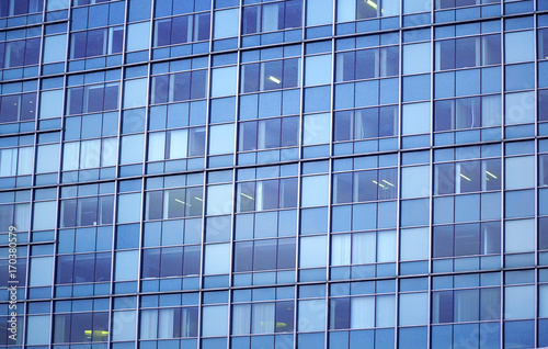 close up on modern office building with blue glass windows