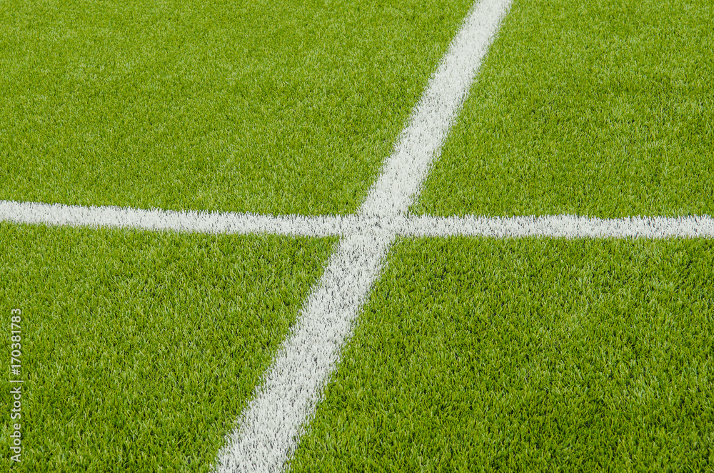 The white Line marking on the artificial green grass soccer field The white Line marking on the artificial green grass soccer field