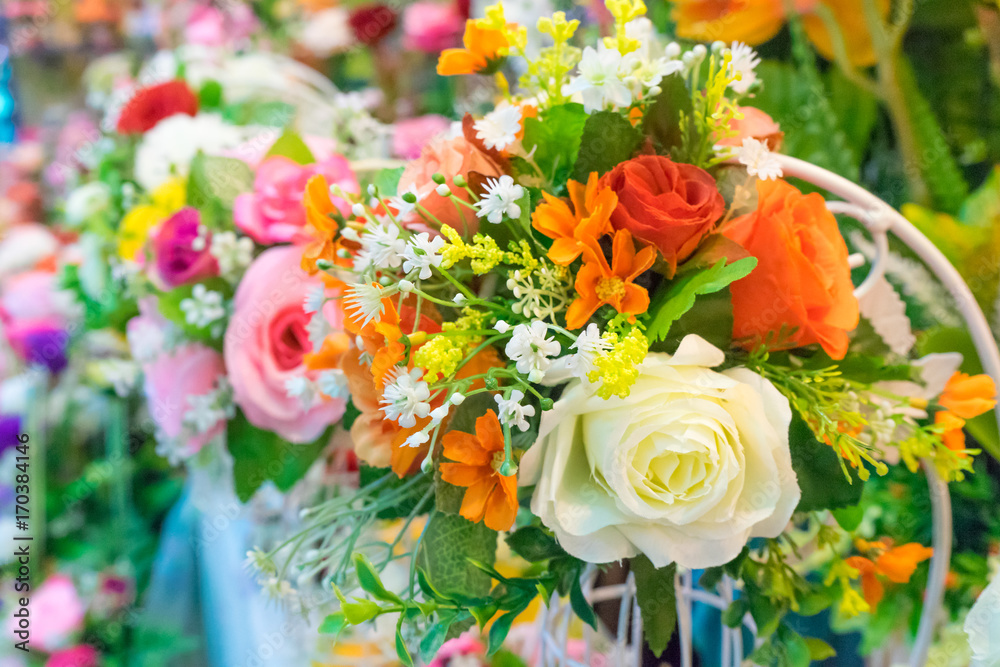Rose fake flower and Floral background. rose flowers made of fabric. The fabric flowers bouquet. Colorful of decoration artificial flower Rose fake flower and Floral background. rose flowers made of fabric. The fabric flowers bouquet. Colorful of decoration artificial flower