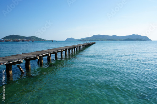 Wooden bridge into the sea. Property is located at the end of the runway into the sea