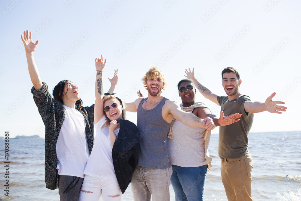 Happy friends having fun and enjoying party by seaside on weekend Happy friends having fun and enjoying party by seaside on weekend