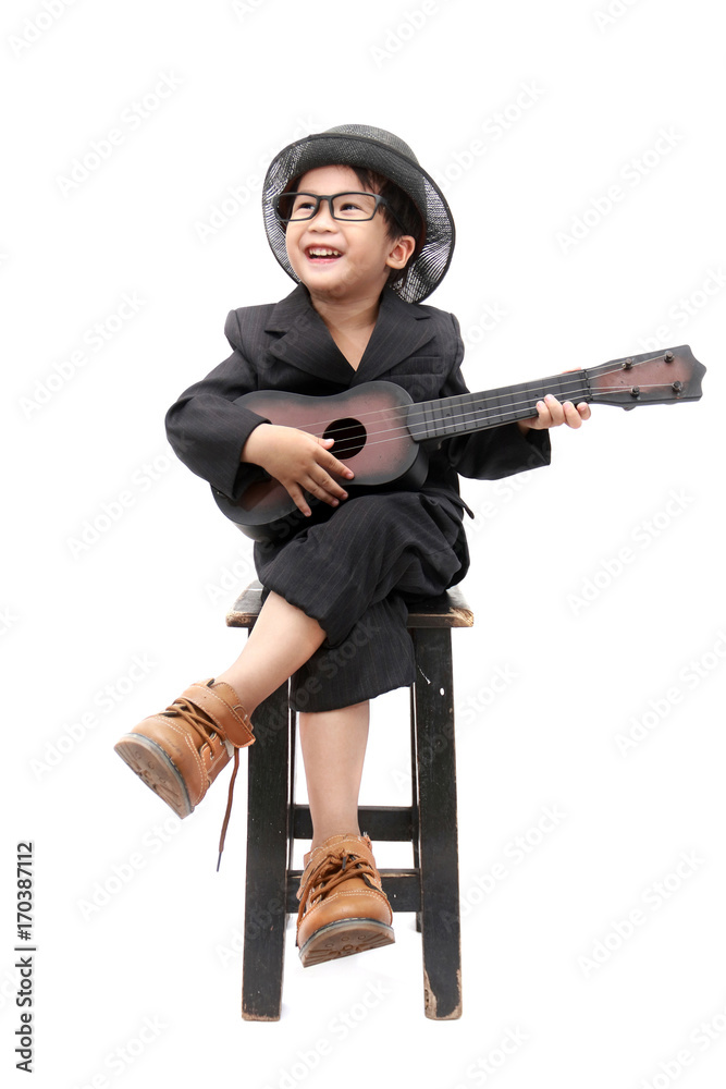 asian boy playing guitar on isolated white background