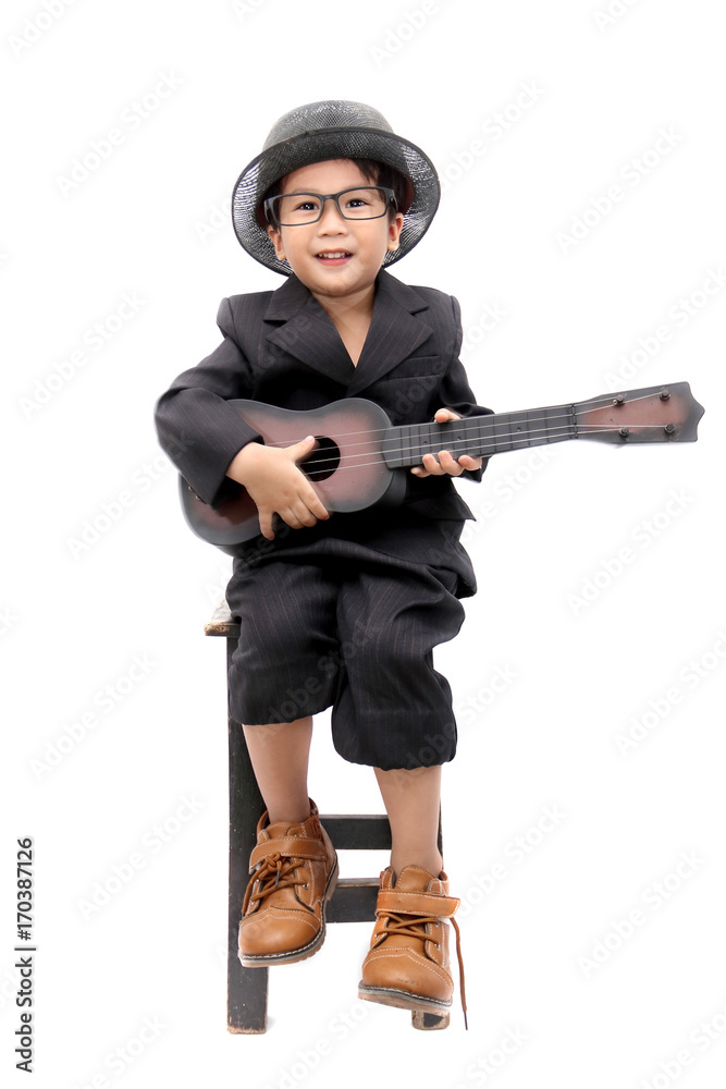 asian boy playing guitar on isolated white background asian boy playing guitar on isolated white background