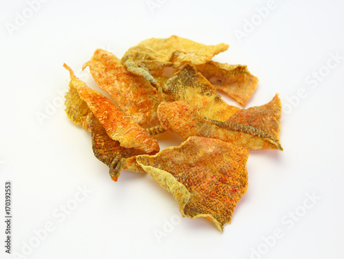 Crispy fried salmon skin on white background.
