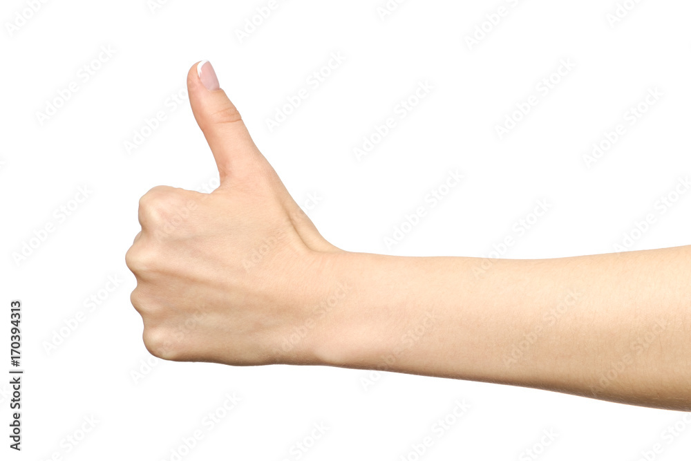 Closeup of female hand showing thumbs up sign Closeup of female hand showing thumbs up sign