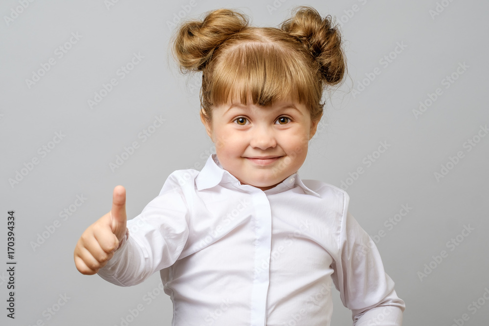 Portrait of cute girl showing thumbs up sign Portrait of cute girl showing thumbs up sign