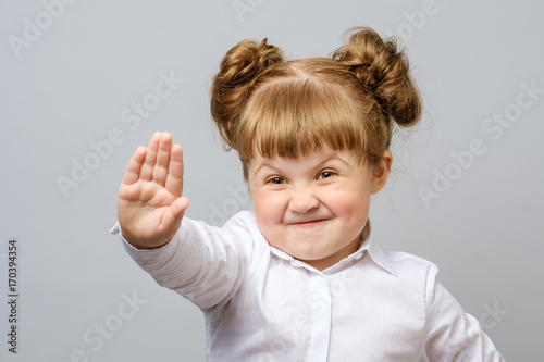 Girl making stop gesture with her hand photo