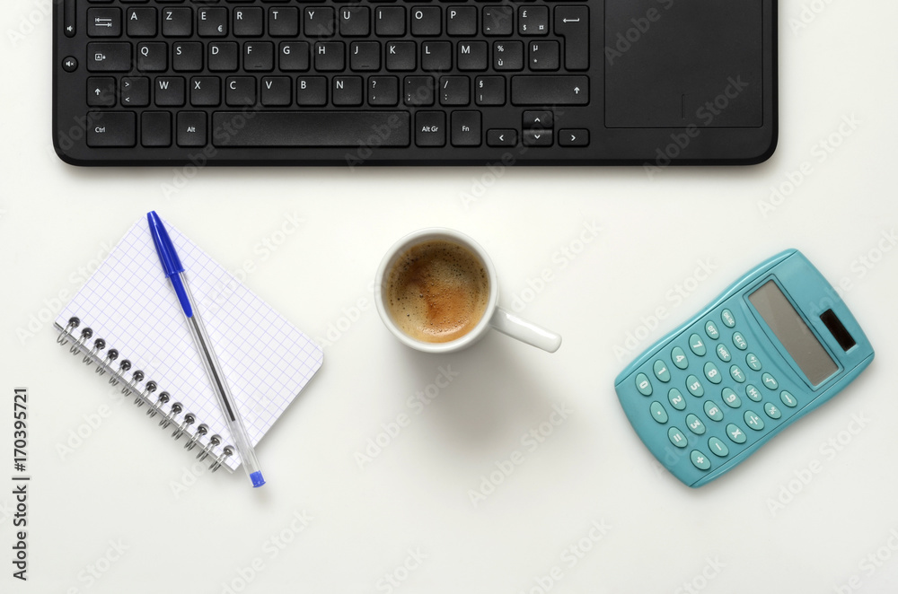 Office : PC keyboard, notebook, calculator and coffee cup Office : PC keyboard, notebook, calculator and coffee cup