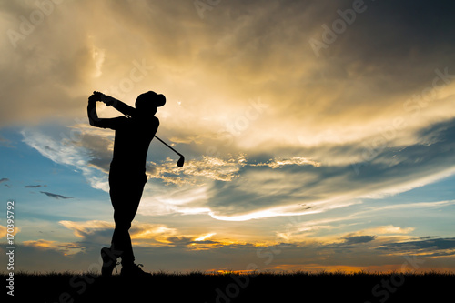silhouette golfer playing golf during beautiful sunset