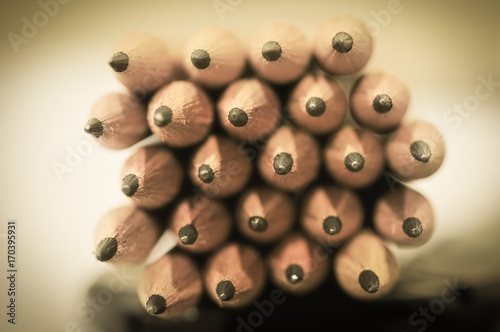 Abstract background of pencils with extremely shallow dof. Selective focus limited to front pencil