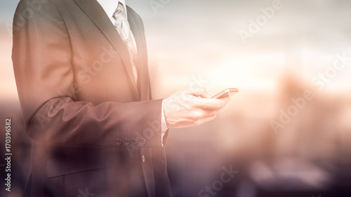 business man using mobile smartphone, close up of a copy space