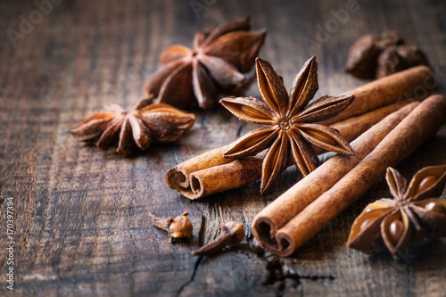 Fototapeta Naklejka Na Ścianę i Meble -  Traditional Christmas spices - star anise, cinnamon sticks and cloves for festive baking