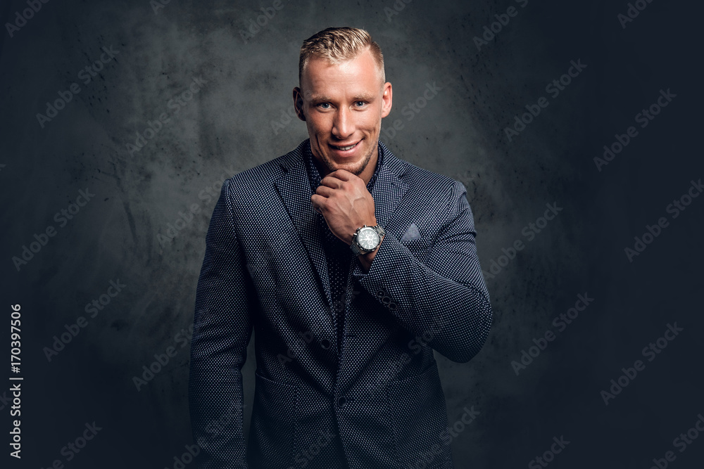 Studio portrait of a male dressed in a blue suit. Studio portrait of a male dressed in a blue suit.