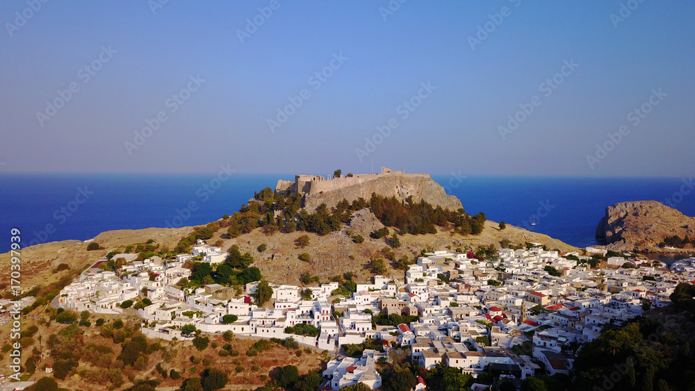 Aerial drone photo of iconic ancient Acropolis - village of Lindos, Rodos island, Aegean, Dodecanese, Greece