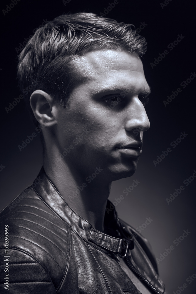 head and shoulders shot, one young adult man Caucasian, black background, studio, head headshot face, leather jacket, portrait head and shoulders shot, one young adult man Caucasian, black background, studio, head headshot face, leather jacket, portrait