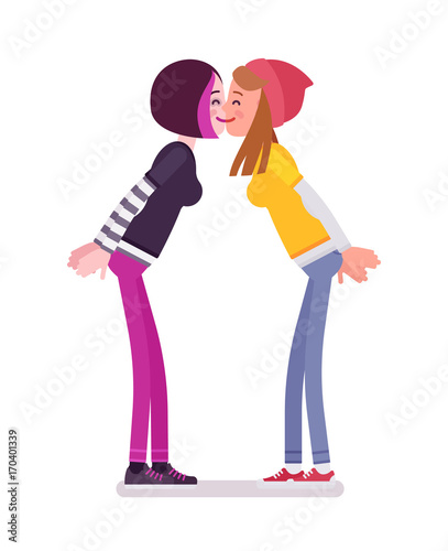Young women exchanging kisses