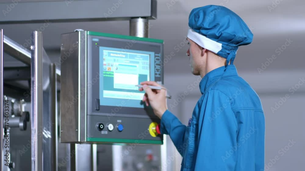 Touch screen technology. Close up of factory worker program touch screen control. Factory employee control screen. Industrial factory control display. Industrial control screen