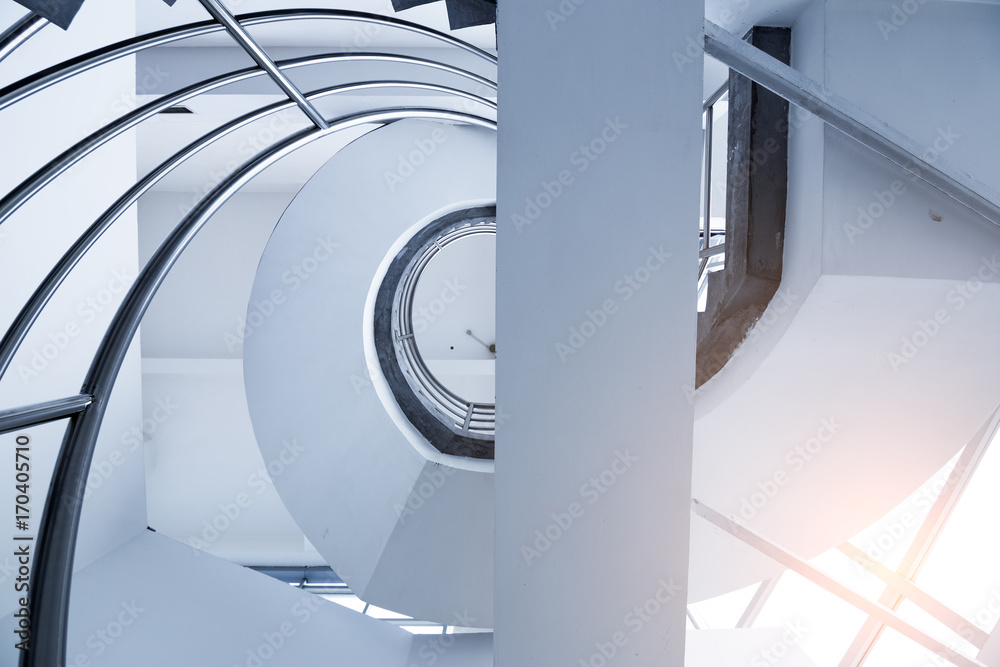 Fototapeta premium black and white spiraling stairs in the square