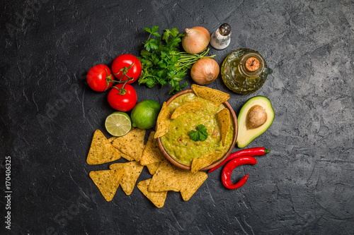 Bowl of delicious homemade Guacamole with nachos
