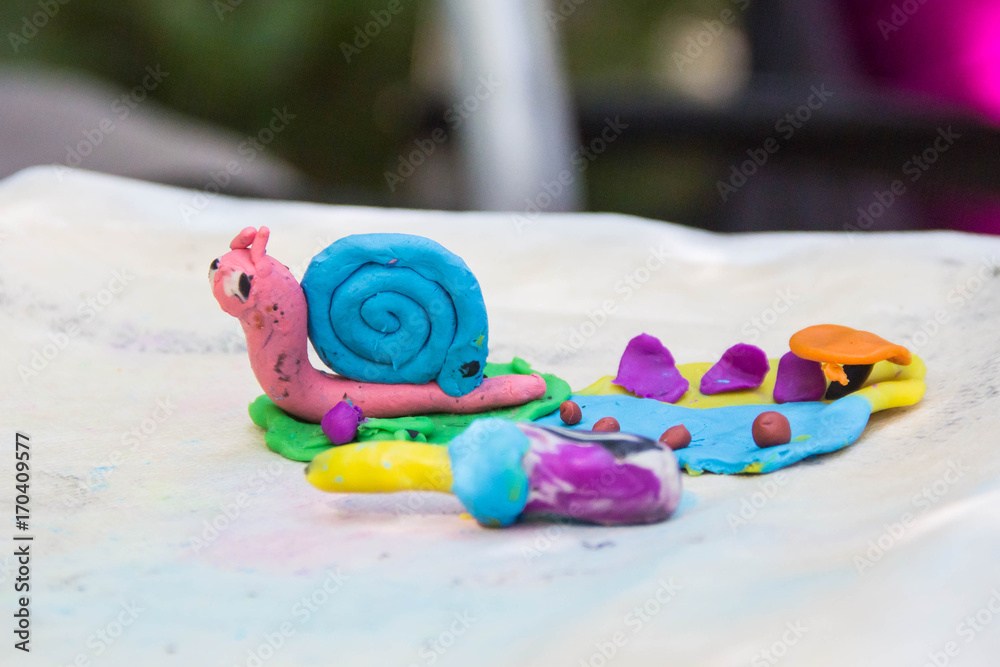 Pink blue snail made from color plasticine