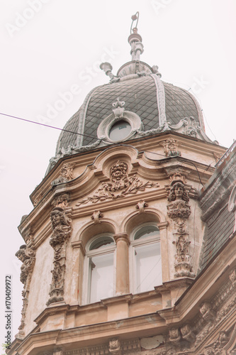 The down view of the old gothic house under the white sky. photo