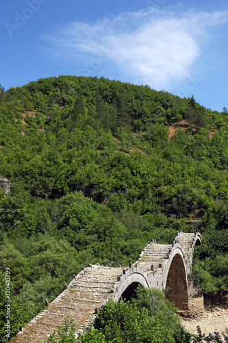 Old Kalogeriko stone bridge on Vikos gorge Zagoria Greece