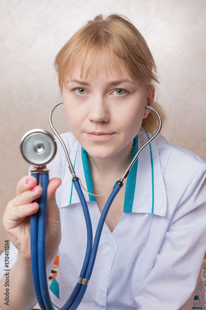 young woman holding a stethoscope