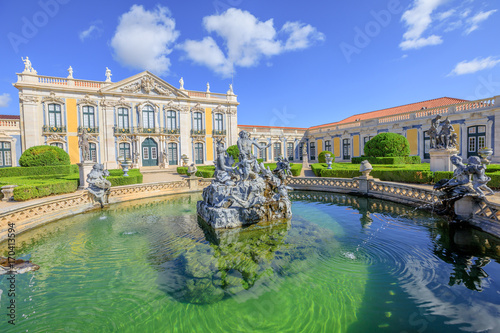 Baroque facade of Queluz National Palace and Neptune Fountain in Sintra, Lisbon district. Defined as the Versailles of Portugal, the Royal Palace of Queluz was used as a fun place for the royal family