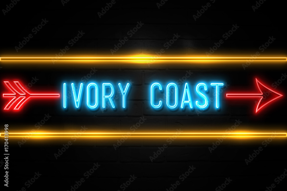 Fototapeta premium Ivory Coast - fluorescent Neon Sign on brickwall Front view