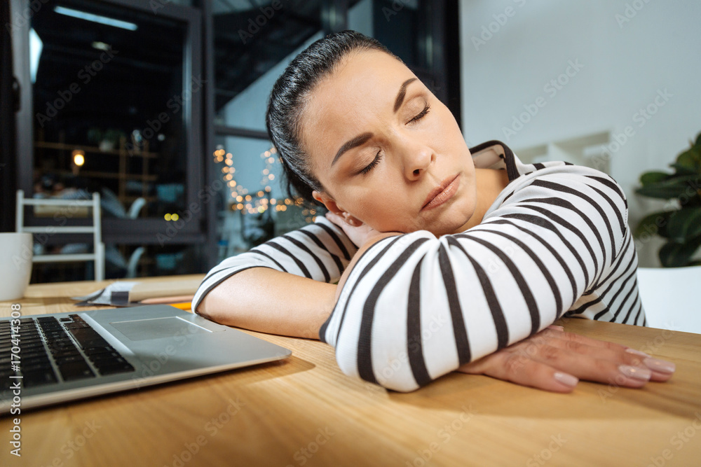 Pleasant attractive woman having a nap Pleasant attractive woman having a nap