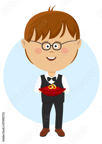 Page boy carrying wedding rings on cushion