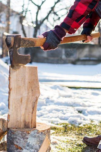 Wallpaper Mural Man cutting firewood for the winter Torontodigital.ca