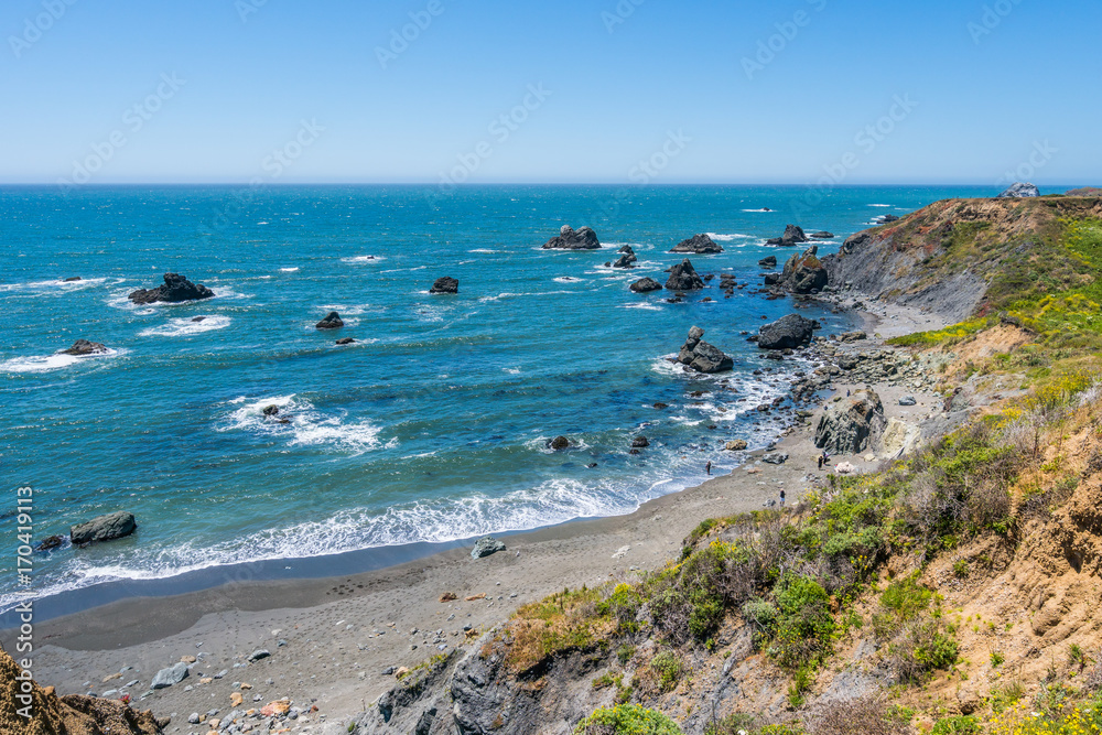 Incredible landscape of the coast. Beautiful blue sea. The waves rolled ashore and breaking on the rocks. Sonoma Coast State Park, California, USA