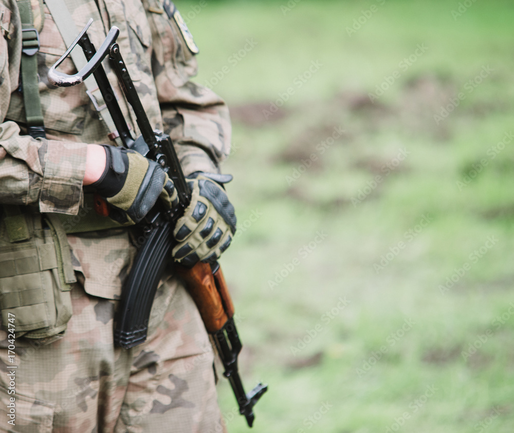 close up on soldier with machine gun close up on soldier with machine gun