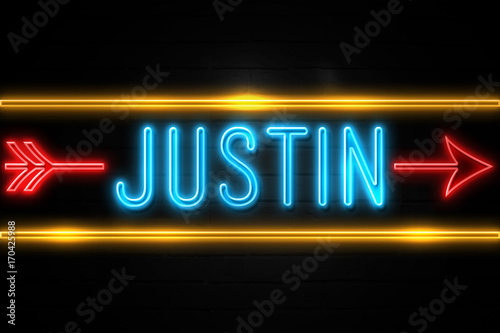 Justin  - fluorescent Neon Sign on brickwall Front view photo