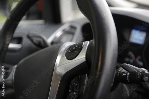 OK button on the steering wheel of the car © Mashevur