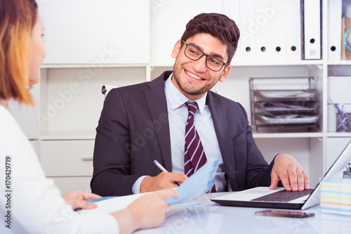 Businessman talking to colleague
