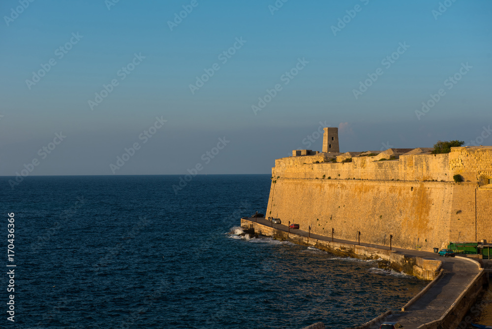 Ancient walls of Valetta fortress in the evening. Malta