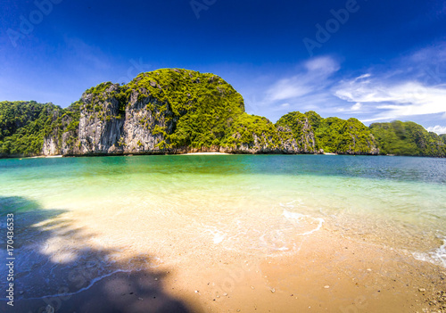 beautiful secluded beaches among limestone rocks on a sunny day in Lan Ha bay  the miniature Ha Long bay  Vietnam
