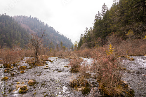 Autumn waterfall on a mountainside in the forest