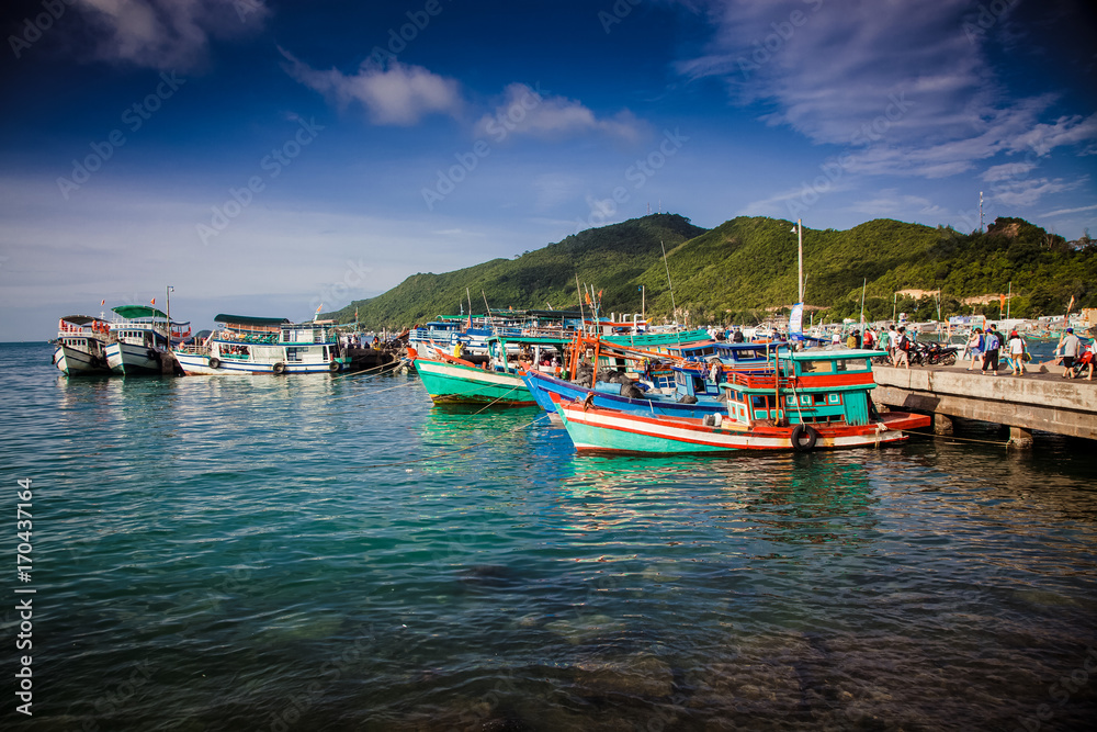 traditional colorful Vietnamese fishing boats in the main port of Nam Du Islands, Kien Giang, Vietnam. Nam Du has become a popular tourist attraction, but foreigner are only allowed in with a permit.