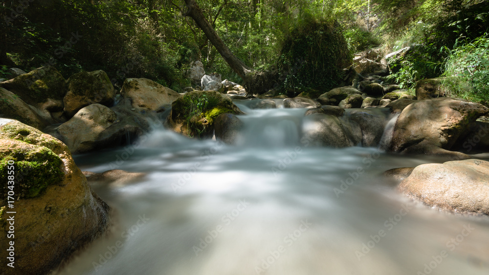 Fast-flowing mountain river in the European Alps Fast-flowing mountain river in the European Alps