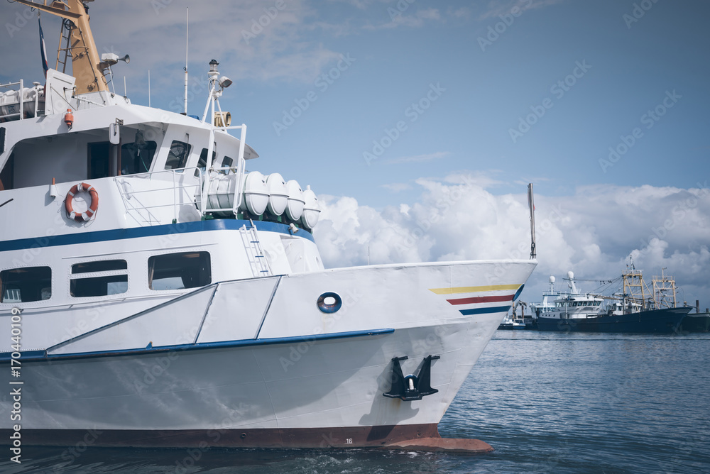 excursion boat in a harbor on the Island of Sylt, Germany under blue sky
