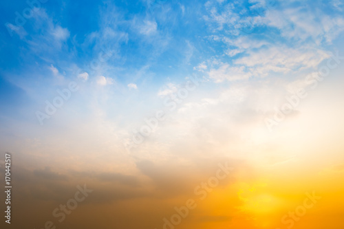 Blue sky with clouds and sun reflection in water with place for your text