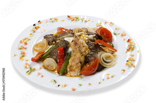 Mixed Turkish kebab with yogurt on a white background