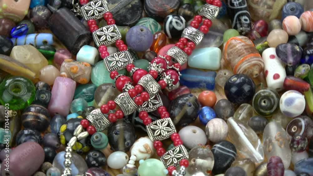 Rotating colorful various indian old and new beads necklace background Rotating colorful various indian old and new beads necklace background