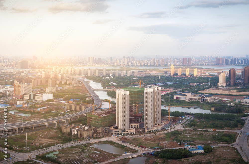 Aerial Cityscape at dusk, China Nanchang buildings and rivers.