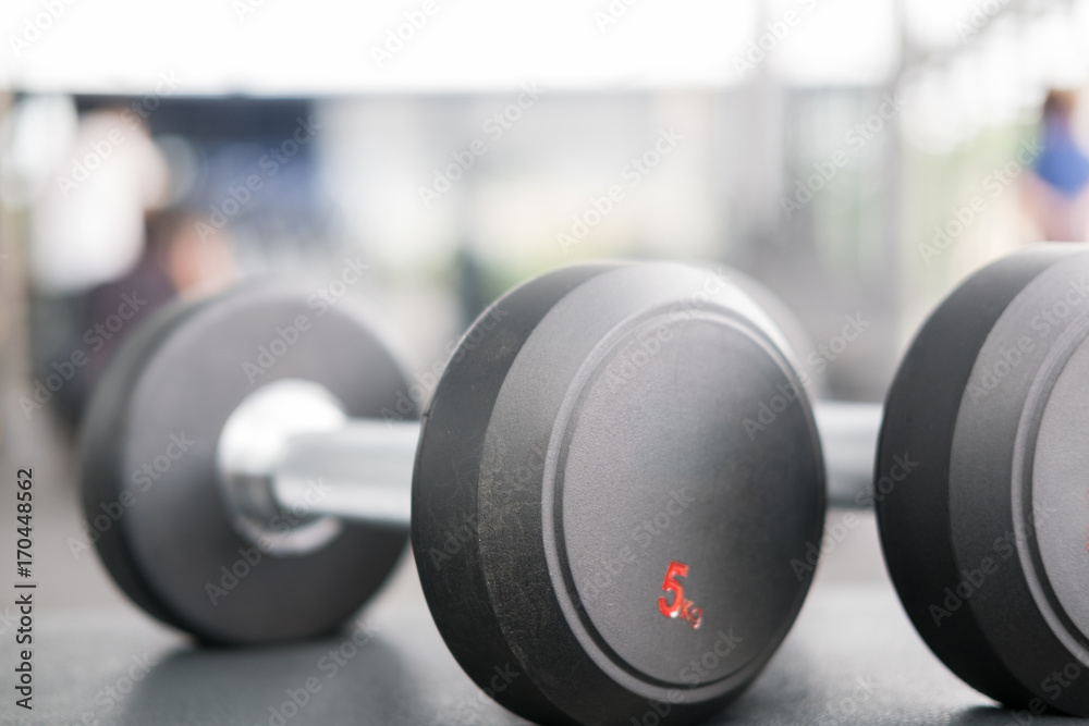 dumbbell in gym or health club. sport, training, fitness lifestyle concept