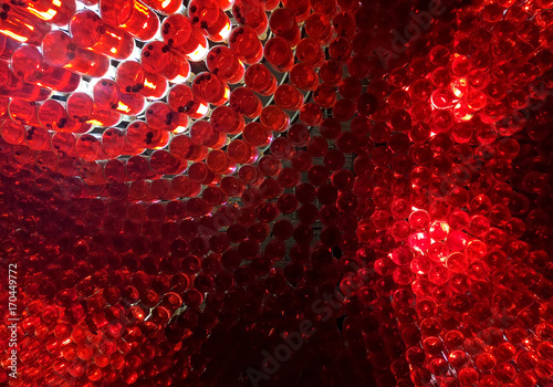 Red abstract background from a bottle filled with wine